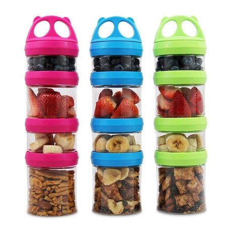 Three colorful stackable snack containers in pink, blue, and green hold various fruits and snacks, showcasing a fun and organized way to store healthy treats.