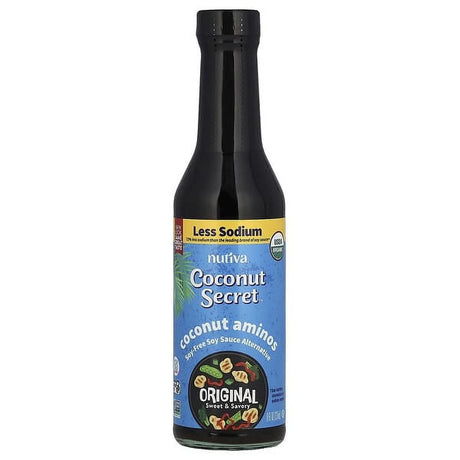 A black bottle of Nutiva Coconut Secret coconut aminos, labeled as a soy-free sauce alternative, features a blue background with tropical designs and highlights "Less Sodium" and "Original Sweet & Savory."