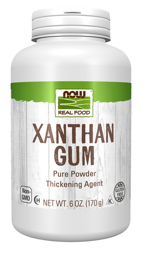 A white container of xanthan gum powder labeled "NOW Real Food," highlighting its use as a thickening agent, with details about being gluten-free and non-GMO.