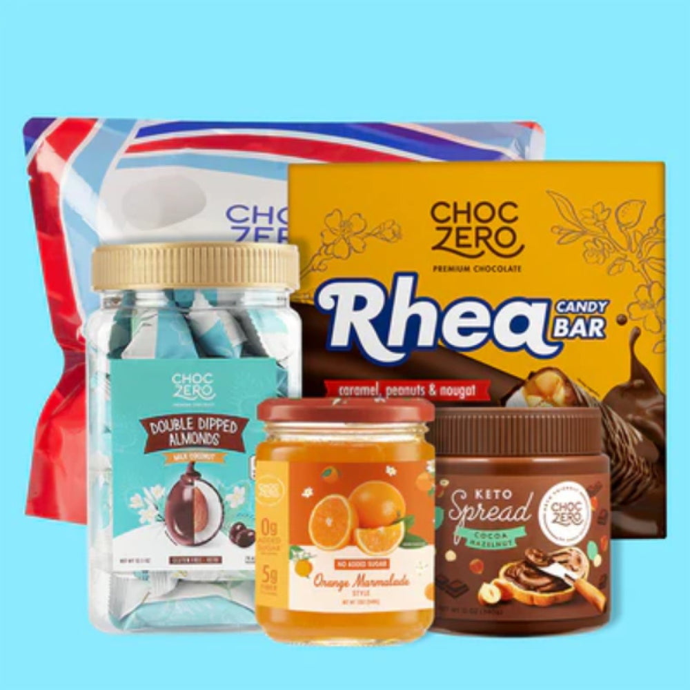 A collection of sweet treats including a jar of double-dipped almonds, orange marmalade, a chocolate candy bar, and a cocoa hazelnut spread, all displayed against a light blue background.
