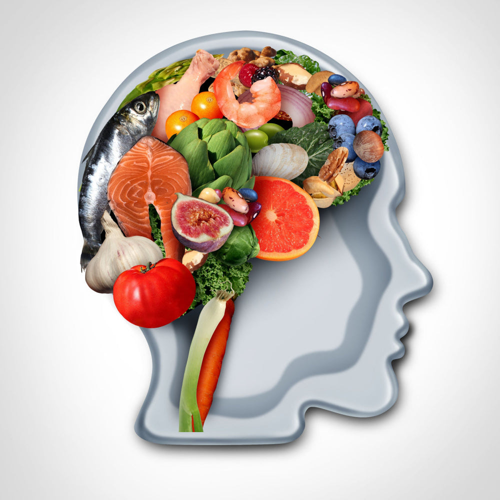 A silhouette of a human head filled with various healthy foods like fish, fruits, and vegetables, symbolizing the connection between nutrition and brain health.