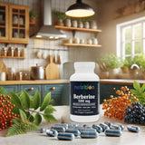 A bottle of Berberine capsules sits on a kitchen counter surrounded by green leaves and colorful berries, with wooden shelves and a window in the background, suggesting a natural health theme.