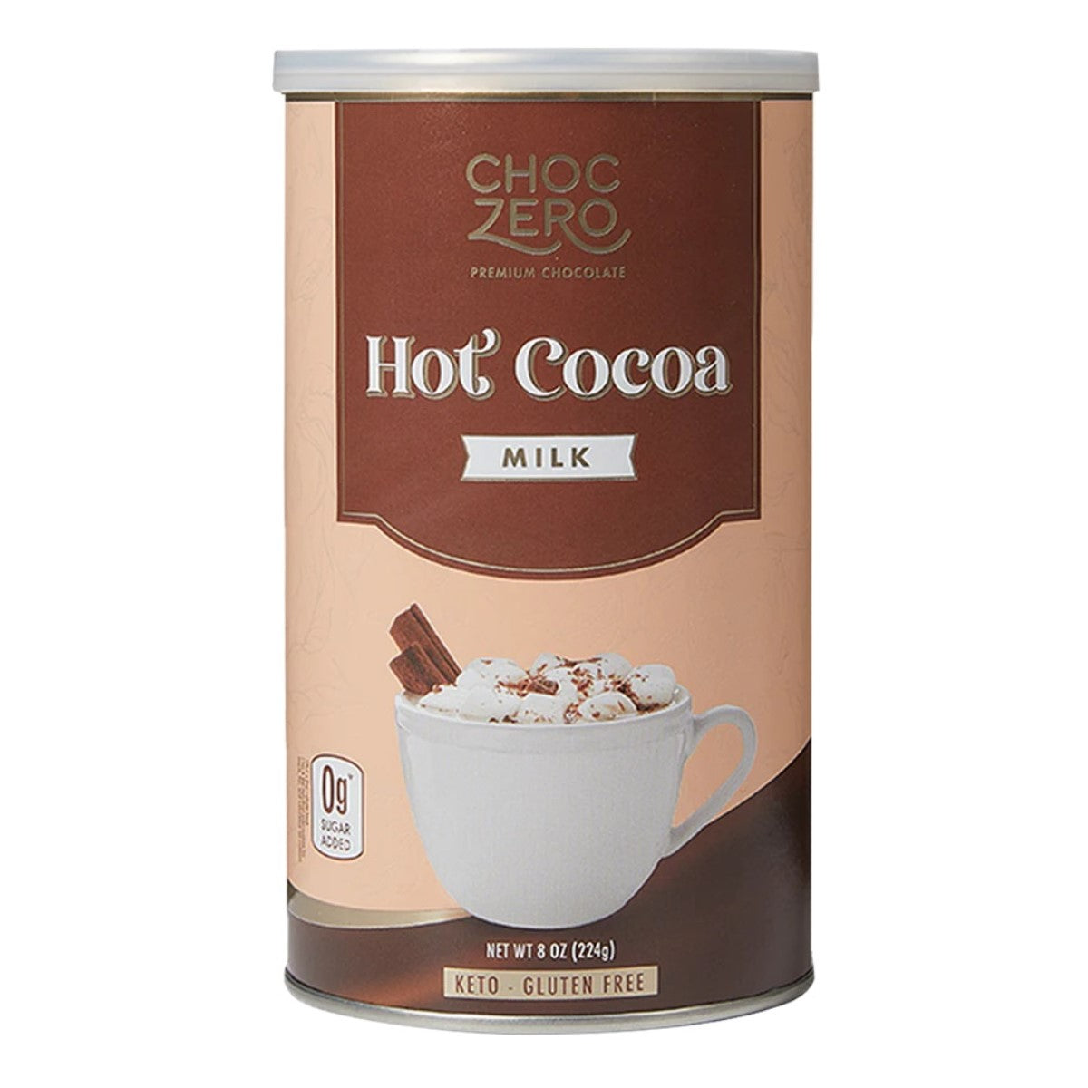 A cylindrical container of Choc Zero hot cocoa mix features a white cup filled with hot cocoa topped with whipped cream and chocolate shavings, with a cinnamon stick beside it, labeled as gluten-free and keto-friendly.