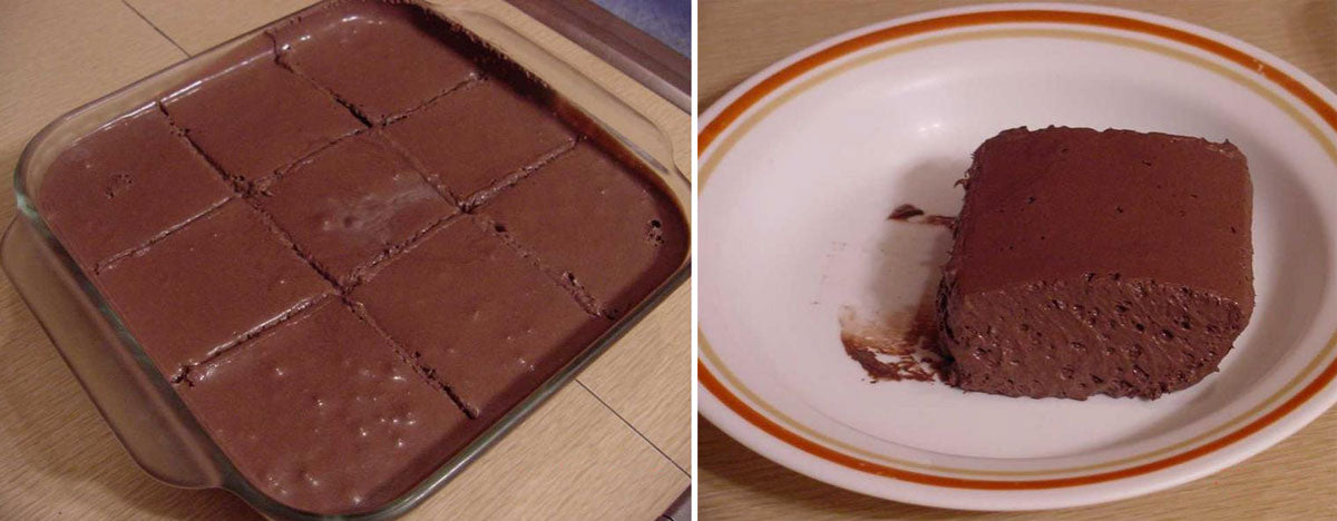 A glass dish contains neatly cut squares of chocolate fudge, while a single piece sits on a white plate with an orange rim, showcasing its rich texture and color against a wooden surface.