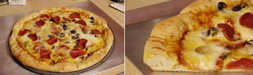 A golden-brown low-carb pizza crust topped with melted cheese, pepperoni, and black olives is placed on a metal tray, showcasing its thick, fluffy edge and delicious toppings.