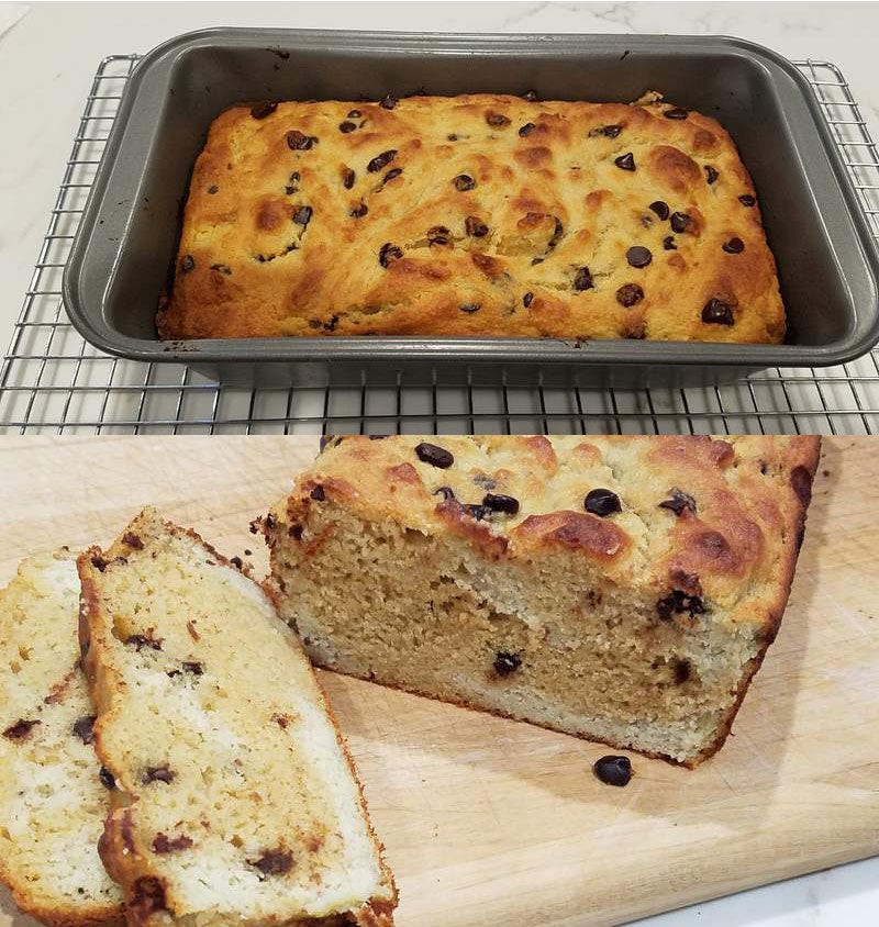 A freshly baked loaf with chocolate chips sits in a metal pan on a cooling rack, while slices of the loaf are cut and displayed on a wooden cutting board, revealing its soft, fluffy interior.