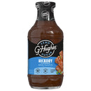 A bottle of G. Hughes Zero Sugar Hickory Flavored BBQ Sauce, featuring a black and blue label, displays nutritional information and highlights that it is gluten and dairy free.