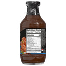 A bottle of zero sugar barbecue sauce displays nutritional information and ingredients on its label, highlighting its low calorie count and serving size of two tablespoons.