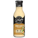 A clear bottle of G. Hughes Honey Dijon flavored dressing features a black label with "Zero Sugar" and nutritional information, showcasing its gluten-free and dairy-free attributes.