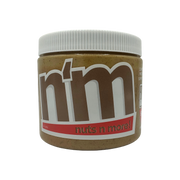 A close-up of a jar of "Nuts n More" nut butter, featuring a white lid and a label with bold brown and red text, set against a black background.