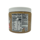 A jar of peanut butter with a white lid displays nutrition facts and ingredient information, highlighting allergens and serving size on a black background.