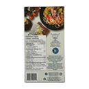 A nutrition facts label on a food package displays cooking instructions and nutritional information, alongside a plate of spaghetti topped with cheese and basil, and fresh tomatoes in the background.