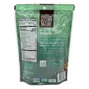 A green bag of Second Nature Keto Crunch Smart Mix displays nutrition facts and highlights its protein-rich ingredients, including nuts and cocoa, with a commitment to sustainability.
