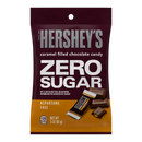 A maroon bag of Hershey's Zero Sugar caramel-filled chocolate candy displays the product name prominently, with images of chocolate pieces and nutritional information highlighted.