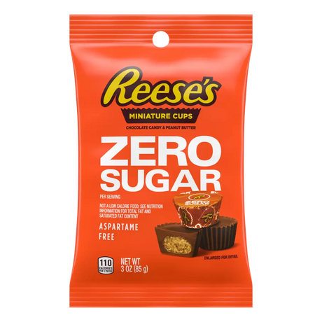 A bright orange packaging features Reese's Miniature Cups labeled "Zero Sugar," showcasing chocolate candy and peanut butter with nutritional information and a note that it's aspartame-free.
