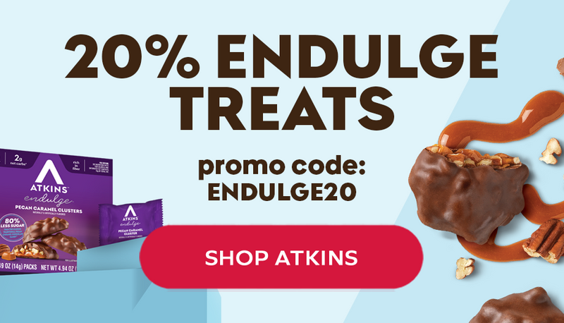 A promotional graphic featuring Atkins' Pecan Caramel Clusters, highlighting a 20% discount with the code "ENDULGE20" and a call to action to shop, set against a light blue background.