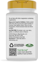 A white supplement bottle with a yellow cap displays safety warnings, storage instructions, and product information, including gluten-free and vegetarian labels, along with a QR code for more details.