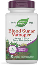 A white bottle of Nature's Way Blood Sugar Manager dietary supplement, featuring a purple cap, labeled with "Supports Blood Sugar Metabolism" and containing 90 capsules in a premium blend of six herbs.