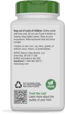 A white supplement bottle with a green cap displays safety instructions, ingredients, and recycling information, emphasizing its vegan nature and made from recycled plastic.