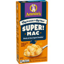 Annie's Super Mac box features a bright orange design, highlighting "15g Protein & 6g Fiber," with a spoonful of creamy shells and real aged cheddar pasta, emphasizing its organic ingredients.
