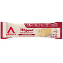 A coconut crème-flavored high protein bar from Atkins, featuring 13g of protein, 2g of net carbs, and 1g of sugar, packaged in a red and white wrapper with a visible bar section.