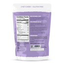 A purple package of peanut butter cups displays nutrition facts, highlighting 2 net carbs and gluten-free status, with text about their ingredients and a historical reference to monk fruit.