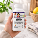 A hand holds a white bottle of BariatriciPal Triple Source Magnesium Chewable tablets.