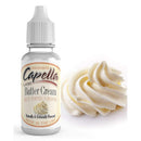 A bottle of Capella concentrated Butter Cream flavoring stands next to a swirl of creamy buttercream, highlighting its use for enhancing various recipes.