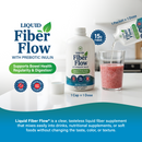 A bottle of Liquid Fiber Flow is shown next to a glass of pink smoothie, with a packet being poured into the glass, highlighting its use as a tasteless fiber supplement for digestion support.