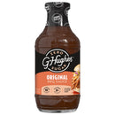 A bottle of G. Hughes Original BBQ Sauce, featuring a black and orange label, is displayed prominently with information about being zero sugar, gluten-free, and dairy-free.
