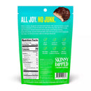 A teal bag of Skinny Dipped coconut almond bites features a playful slogan, nutrition facts, and highlights like gluten-free and no artificial colors, promoting a fun and healthy snack option.