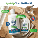 A bottle and a smaller packet of Liquid Fiber Flow sit on a wooden surface with oats, promoting gut health with 15 grams of fiber, and highlighting that it's tasteless and easy to mix into foods and beverages.