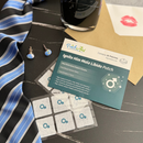 PatchAid male libido patches on a table with a tie and ink bottle.
