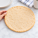 Inspire Artisan Thin Pizza Crust twin-pack packaging with Nutrition Facts, ingredients, preparation directions and storage instructions. Each quarter crust has 50 calories, 1 gram of net carbs and 7 grams of protein.