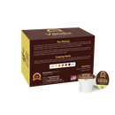 A brown coffee box labeled "Vanilla" features a single coffee pod with a vanilla flavor, highlighting its organic ingredients and low-acid benefits for sensitive stomachs.