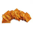 A pile of crispy, seasoned tortilla chips is arranged in a staggered formation, showcasing their golden-brown color and textured surface against a plain white background.
