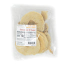 A clear plastic bag contains low-carb bagel chips labeled "Cinnamon & Sugar," showcasing several round, light-colored chips with nutritional information on the front.