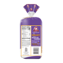 A loaf of bread in a clear plastic bag with a purple wrapper and a large front label. The wrapper has a purple top fold with the Aunt Millie logo, and the label reads 'The SMART way to WATCH CARBS' with the Aunt Millie logo.