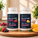 Two bottles of Bariatric Pal Multivitamin One, featuring chewable mixed berry and orange citrus flavors, sit on a wooden table surrounded by fresh berries and orange slices, with sunlight streaming in.