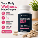 A white bottle of BariatricPal Multivitamin One dietary supplement capsules displayed on a light beige surface with scattered capsules around it. The left side features promotional text and icons highlighting benefits like immunity, energy, and overall wellness.