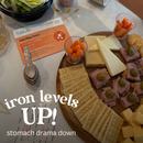 Snack platter with cheese, crackers, and meat on a table with a 'PediaSure' iron supplement package.