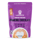 A purple package of Lakanto Monkfruit Sweetened Drinking Chocolate powder features the product name prominently, highlighting it's sugar-free, keto-friendly, and vegan, with 18 servings per bag.