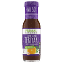 A bottle of Primal Kitchen No Soy Teriyaki Sauce and Marinade features a purple label with white text, highlighting its soy-free and no artificial sweeteners attributes, alongside an orange and garlic illustration.