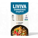 A blue and white package of LIVIVA Shirataki Spaghetti displays the product name prominently, with a photo of cooked spaghetti topped with sauce and basil on a black plate.