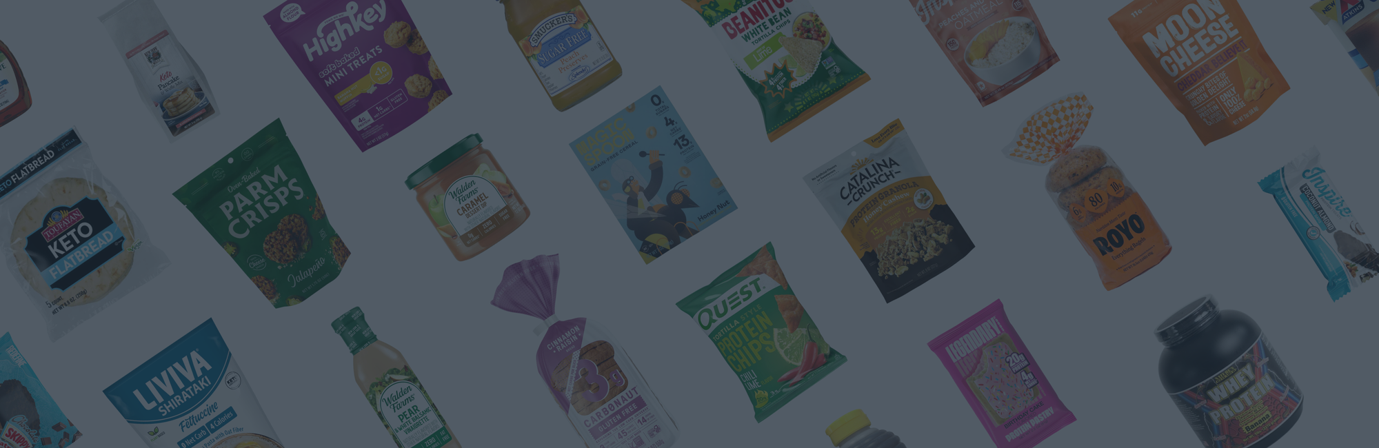A variety of colorful food packaging is displayed, featuring snacks and health products like keto flatbread, protein bars, and granola, arranged in a dynamic, diagonal layout on a light background.