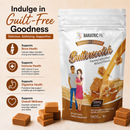 A stand-up pouch of BariatricPal Butterscotch flavored calcium soft chews stands on a beige surface with several soft chews placed in front. The package is white and brown with caramel-colored butterscotch imagery and a small illustration of a man and woman.