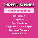 The image displays a pink background with the text "Three Wishes" at the top and a list of ingredients below, including chickpea, tapioca, pea protein, organic cane sugar, natural flavors, and monk fruit.