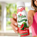 Woman holding 30g Protein Shot Watermelon Flavor