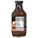 A clear bottle of zero sugar barbecue sauce displays nutrition facts and ingredients on the label, highlighting its low calorie content and suitability for various dishes.