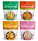 Four colorful bags of Ashapops popped water lily seeds are displayed, featuring flavors: Vegan Cheese, Chili, Turmeric Garlic, and Himalayan Pink Salt, each labeled with calorie information.